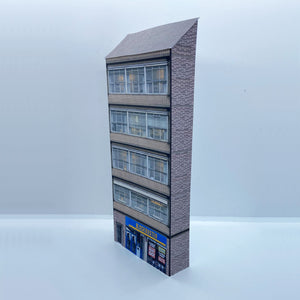 Low relief OO gauge building with shops from the 80s and 90s